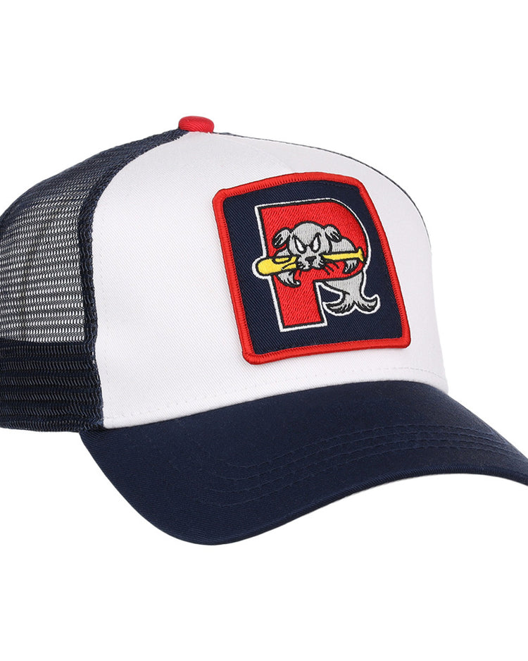 The Ebbets Field Portland Sea Dogs MiLB Trucker Ballcap features a white front, navy blue bill and mesh back, plus a patch with a stylized fish holding a bat inside a red-bordered 
