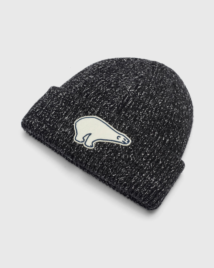 Cerveceria Polar Bear Felt Patch Ribbed Beanie in black and white speckled rib-knit with a felt polar bear patch on the front cuff.
