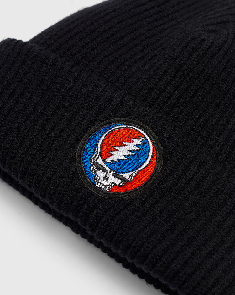 Black ribbed knit Ebbets Field Grateful Dead Stealie Felt Patch Ribbed Beanie with a circular Grateful Dead Steal Your Face patch.