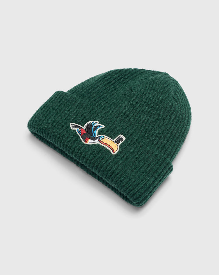 Dark green rib-knit Guinness Flying Toucan Felt Patch Ribbed Beanie featuring a felt patch of a Guinness toucan wearing a top hat.