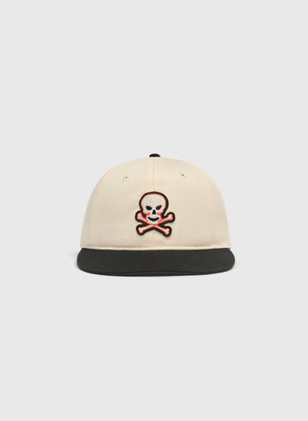 Off-white Sioux City Ghosts Cotton Twill Ballcap featuring a black brim and an embroidered skull and crossbones patch on the front.