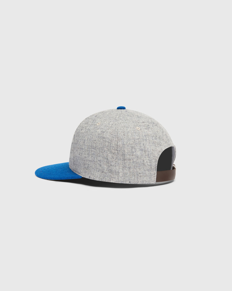 Ebbets Field Mystery Caps of Mexico – San Luis Potosi 1926 Wool Ballcap in grey with a blue brim, blue top button, and a brown leather adjustable strap at the back.