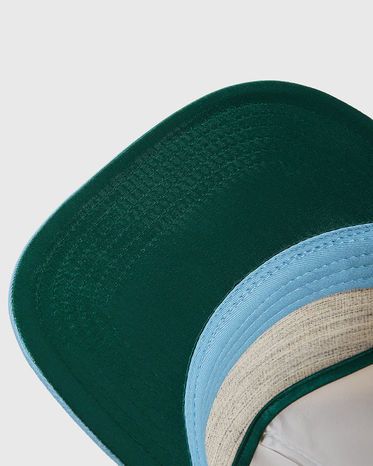 Close-up of the underside of the Chicago Cats A-Frame Cotton Twill Ballcap by Ebbets Field, showing a green brim top, light blue edge, and beige lining on this retro snapback, set against a plain white background.