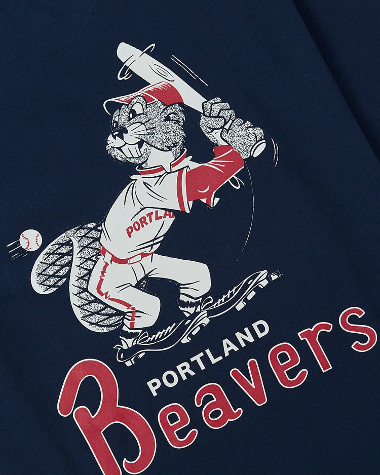 Ebbets Field Portland Beavers Ebbets Tee with Back Print features a beaver in a baseball uniform holding a bat, ready to swing, with bold PORTLAND Beavers text below.