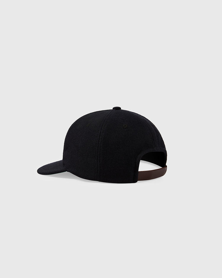 The Ebbets Field Harvard University 1950 Authentic Wool Ballcap in black is displayed from the back, showcasing its curved brim and adjustable dark strap against a plain light gray background.
