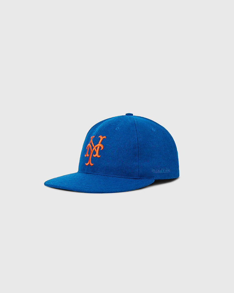 The Ebbets Field New York Mets 1962 MLB Authentic Wool Ballcap, featuring a blue body and orange “NY” logo, is shown on a light gray background.