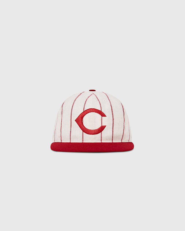 The Ebbets Field Cincinnati Reds 1958 MLB Authentic Wool Ballcap features red vertical pinstripes, a red brim, and a bold red C on the front, displayed against a plain light background.