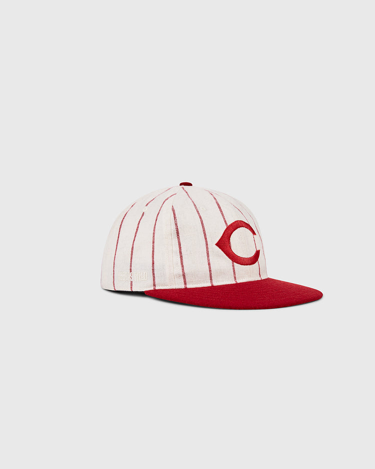 The Ebbets Field Cincinnati Reds 1958 MLB Authentic Wool Ballcap features thin red stripes, a bold red C front logo, and a solid red bill—replicating the iconic 1958 design. Shown on a plain light gray background.