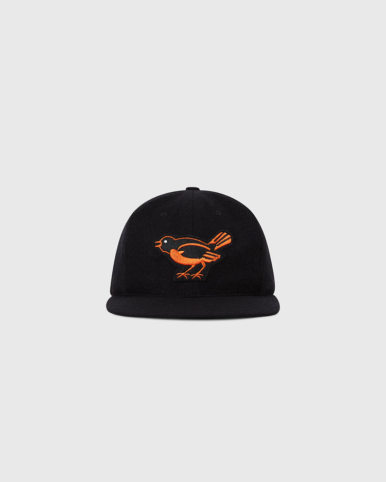 The Ebbets Field Baltimore Orioles 1954 MLB Authentic Wool Ballcap is a black cap with an orange bird embroidered on the front, shown against a plain light grey background.