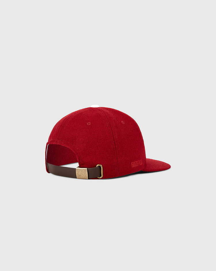 The Ebbets Field Philadelphia Phillies 1964 MLB Authentic Wool Ballcap features a red design with a brown adjustable strap and gold buckle, inspired by the 1964 team’s on-field cap, shown against a plain light gray background.