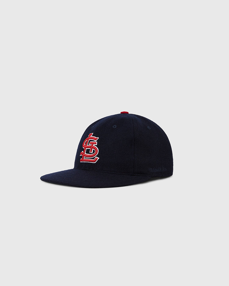 The Ebbets Field St. Louis Cardinals 1963 MLB Authentic Wool Ballcap features a navy design with the team’s red and white logo, inspired by the classic 1963 cap, shown against a light gray background.