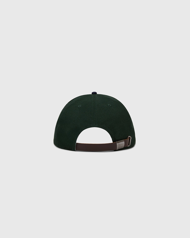 The Ebbets Field Flannels Ebbets Felt Script Cotton Twill Ballcap is shown from the back in dark green, with a brown adjustable strap and metal clasp, set against a plain light grey background—perfect for everyday wear.