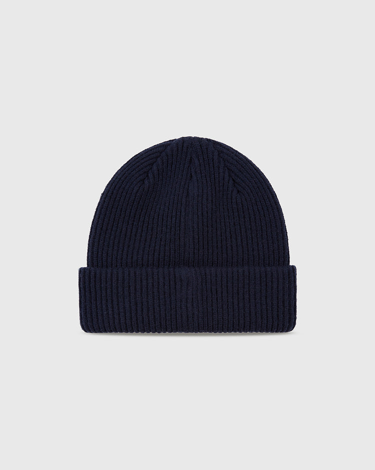 The Ebbets Field San Francisco Seals Patch Logo Ribbed Beanie in navy blue features a folded brim and is shown on a plain light gray background, celebrating the team's Pacific Coast League roots and Seals Stadium legacy.