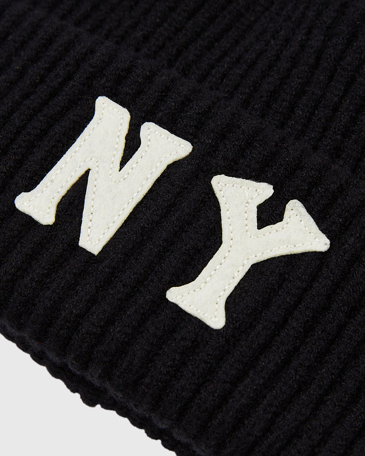 Close-up of the Ebbets Field New York Black Yankees Felt Logo Ribbed Beanie, featuring large white 