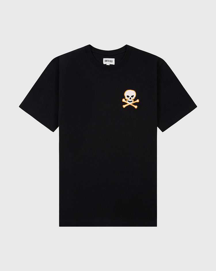The Sioux City Ghosts Embroidered Logo Short Sleeve Tee Shirt by Ebbets Field features a white skull and crossbones logo on black, inspired by vintage tees—perfect for fast-pitch softball fans. Shown against a light gray background.