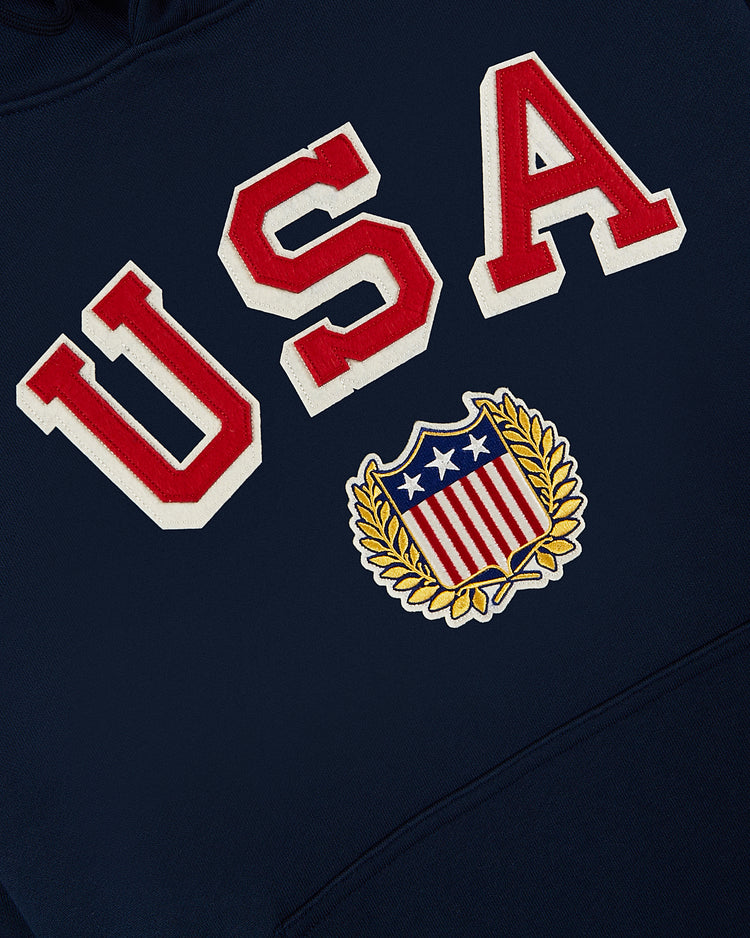 Show your patriotic spirit in the Ebbets Field USA 1960 Heavyweight Cotton Terry Pullover Hoodie, featuring navy blue fabric, bold red and white 
