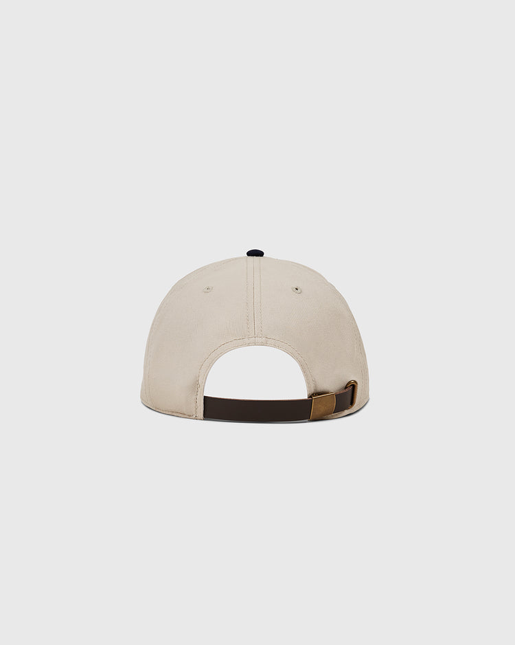 The Ebbets Field Detroit Stars Cotton Twill Ballcap, shown from the back with a black adjustable strap and brass buckle, pays tribute to the 1920 Detroit Stars, echoing Negro Leagues history against a simple background.