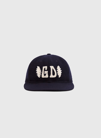 The Ebbets Field Grateful Dead Double Bolt Wool Ballcap features navy blue wool, white GD embroidery, and two lightning bolts, displayed against a plain light gray background.