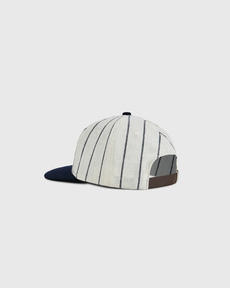 The Ebbets Field US Tour Of Japan 1934 Authentic Wool Ballcap features a cream crown with thin navy stripes, a navy bill, and an adjustable brown strap, shown on a plain light background.
