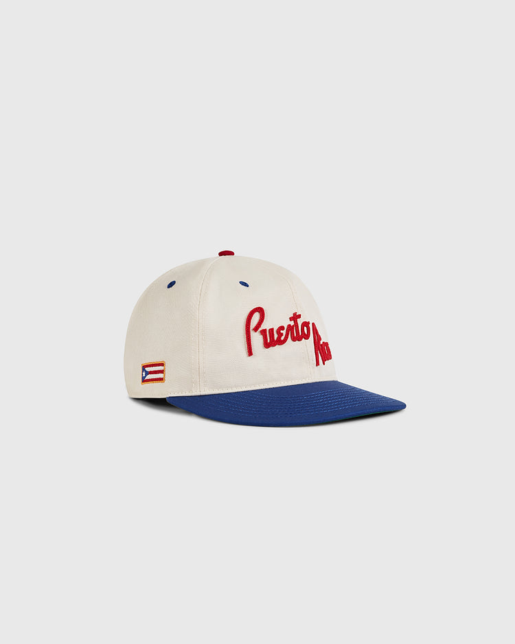 The Ebbets Field Puerto Rico 1958 National Team Cotton Twill Ballcap features a cream crown, blue brim, bold red 