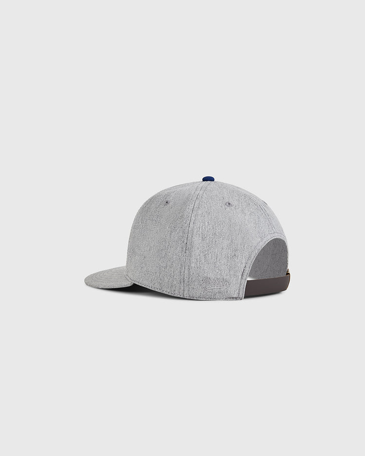 The Ebbets Field Santurce Cangrejeros 1939 Cotton Twill Ballcap, in light gray, is shown from the back left with a curved brim and dark brown adjustable strap, set against a plain white background.