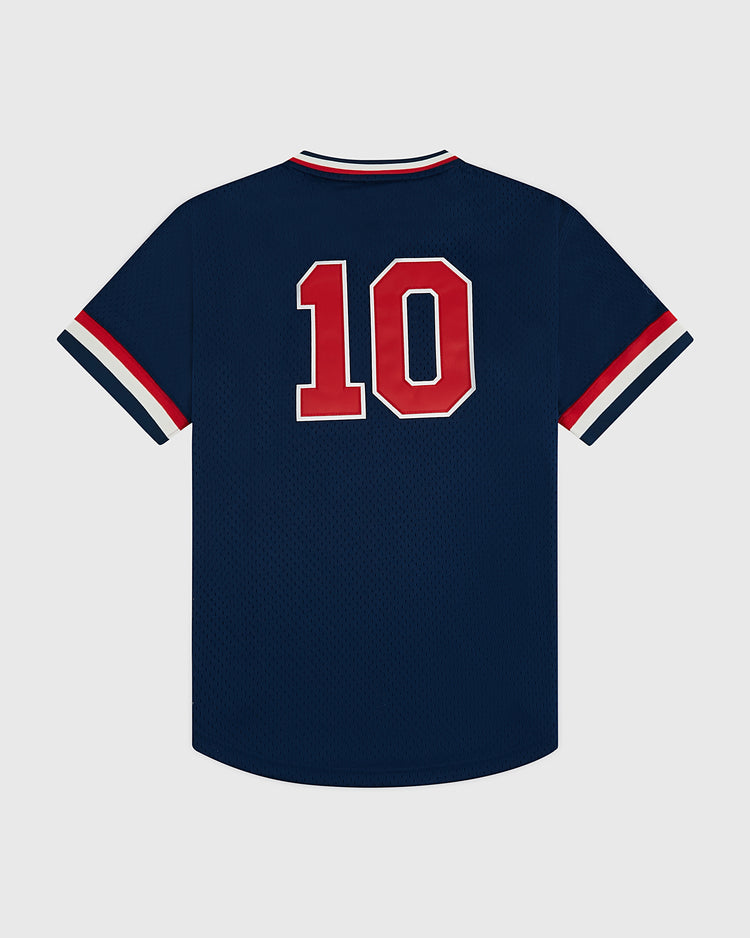 The Ebbets Field USA National Team Mesh V-Neck Jersey is a navy vintage-style top with white and red striped cuffs and collar, plus bold red and white number 10 on the back, shown against a plain light background.