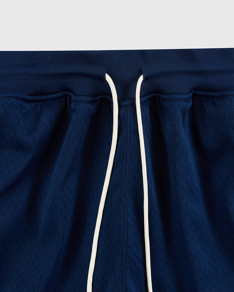 Close-up of the waistband on Ebbets Field USA National Team Mesh Shorts, showing navy blue breathable knit mesh and white center drawstrings.