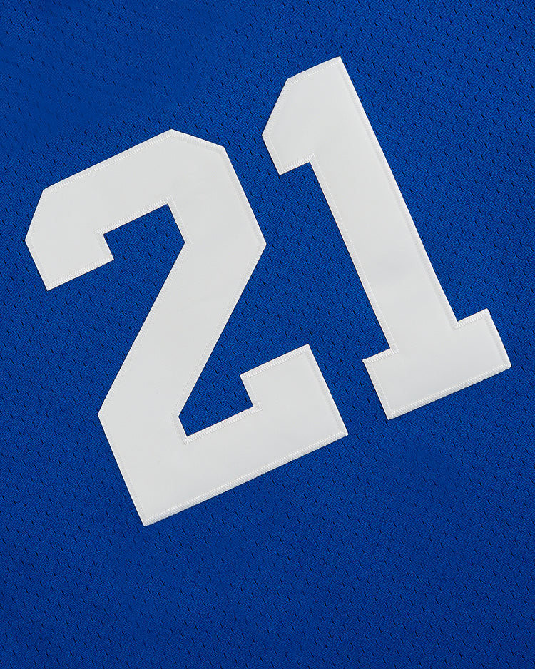 The Ebbets Field Santurce Cangrejeros Mesh V-Neck Jersey is a blue jersey with a white number 21, inspired by the iconic Puerto Rican baseball jersey worn by Roberto Clemente.