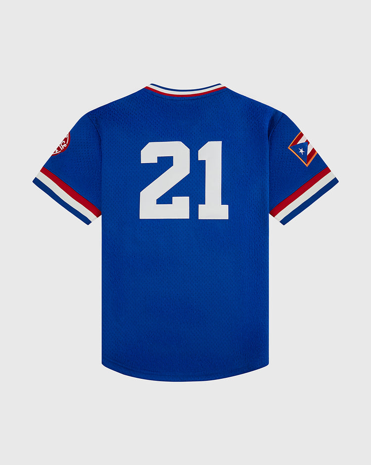 The Ebbets Field Santurce Cangrejeros Mesh V-Neck Jersey is blue with white #21 on the back, red/white/blue sleeve stripes, and a right-sleeve patch. Displayed on a plain light gray background.