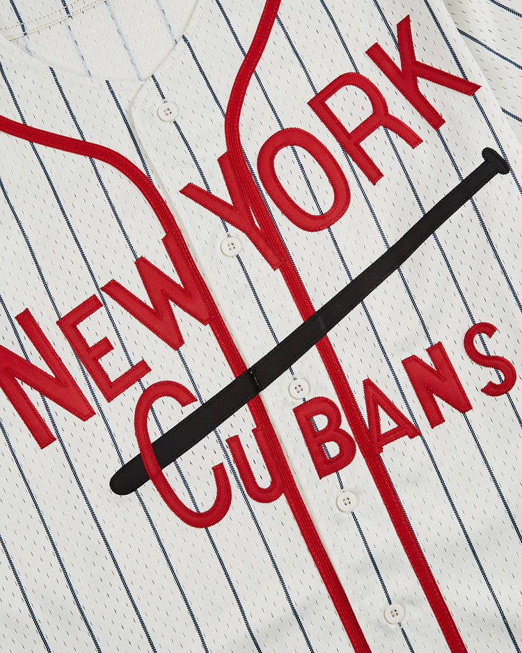 The Ebbets Field New York Cubans Mesh Baseball Jersey features white pinstripes and red lettering, with a black bat laid across the center, celebrating the history of the NY Cubans baseball team.