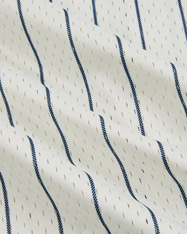 The Ebbets Field New York Cubans Mesh Baseball Jersey features white fabric with wavy navy stripes and dotted accents, evoking the vintage style of classic Negro League teams like the NY Cubans.
