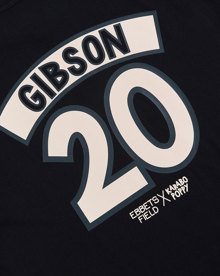 Close-up of the Ebbets Field Karabo Poppy x Josh Gibson Short Sleeve Graphic Tee, featuring bold white GIBSON and 20 print, with 