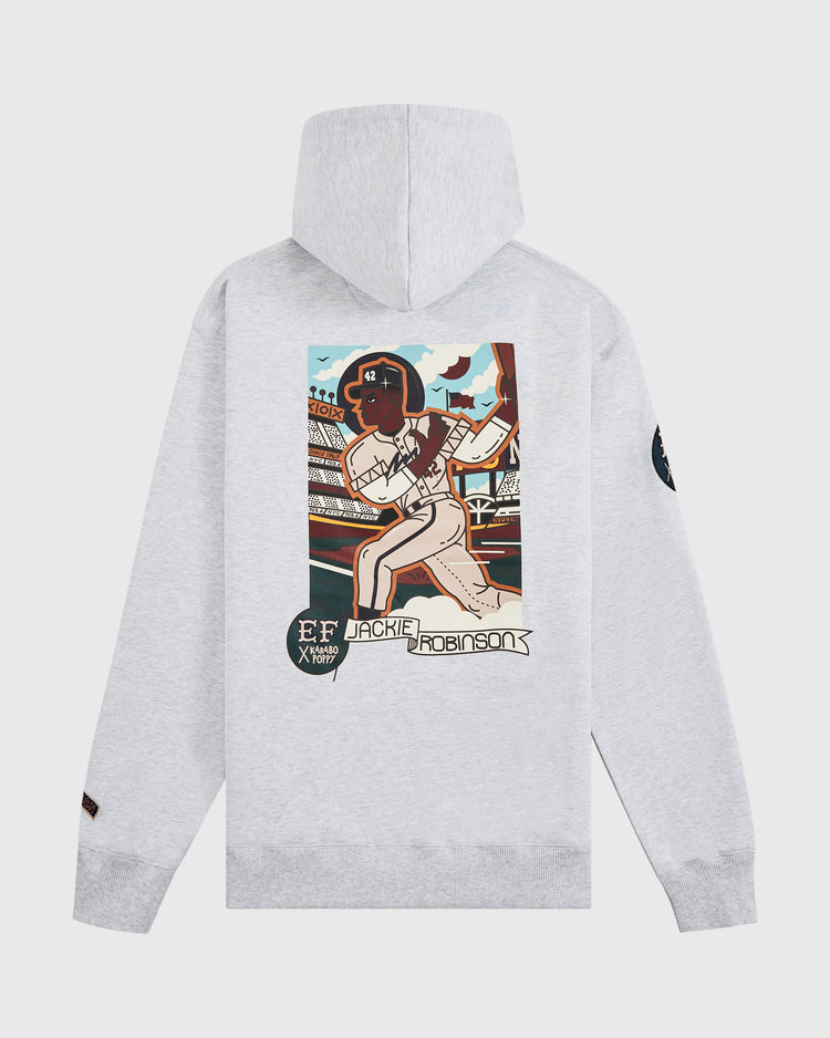 The Ebbets Field Karabo Poppy x Jackie Robinson Heavyweight Cotton Pullover Hoodie features a light gray design with vibrant Jackie Robinson artwork, stadium backdrop, and “Jackie Robinson” text—created for Black History Month with a black patch on the left sleeve.