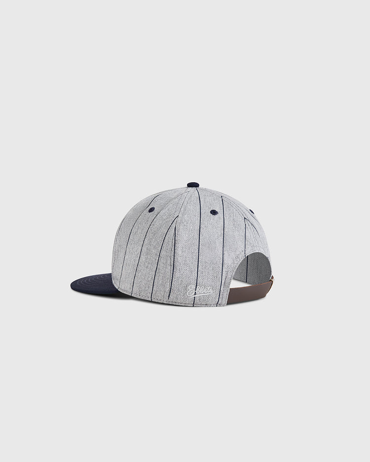 The Ebbets Field Santa Clara Leopardos 1925 Cotton Twill Ballcap features gray and black pinstripes, a navy brim, brown adjustable strap, and 