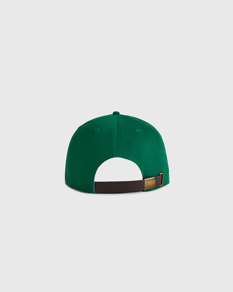 The Ebbets Field Cienfuegos Elefantes Cotton Twill Ballcap, shown from the back with an adjustable brown strap and metal buckle on a light gray background, is ideal for fans of classic Cuban baseball style.