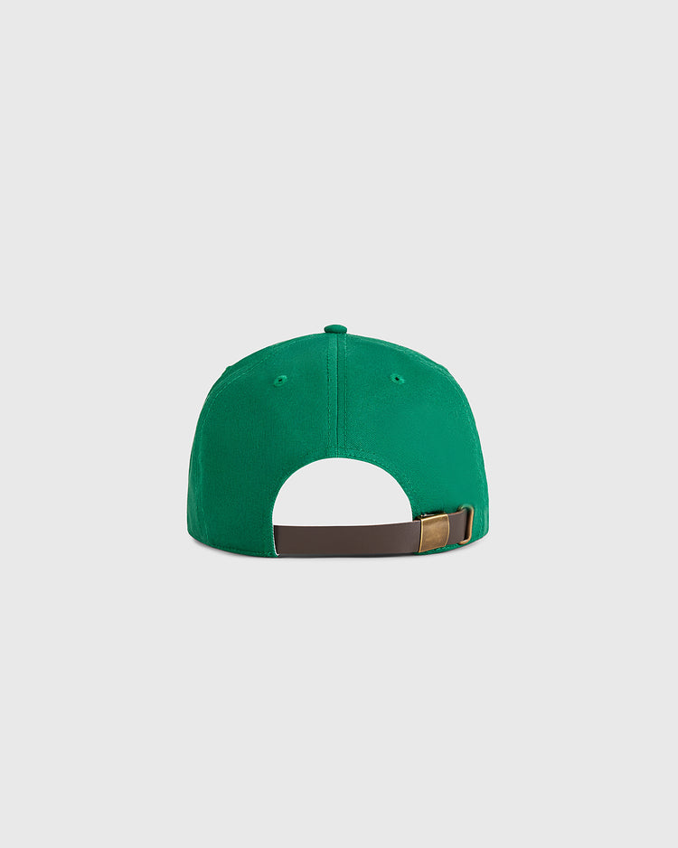 The Guinness Extra Stout Patch Cotton Twill Ballcap by Ebbets Field is shown from the back, displaying an adjustable brown strap with a metal buckle against a plain light gray background.