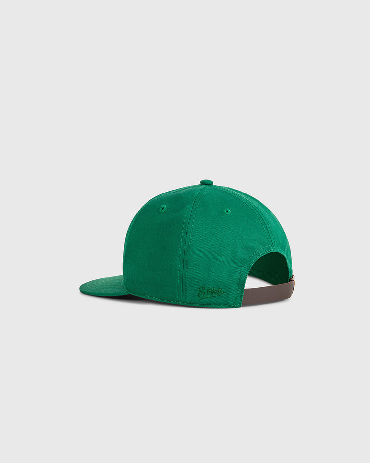 The Ebbets Field Guinness Extra Stout Patch Cotton Twill Ballcap is shown from the back, displaying its green fabric, adjustable brown strap, and slightly curved brim against a plain white background.