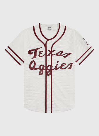 The Texas A&M University 1952 Mesh Baseball Jersey by Ebbets Field features a white mesh body, maroon trim and sleeve stripes, 