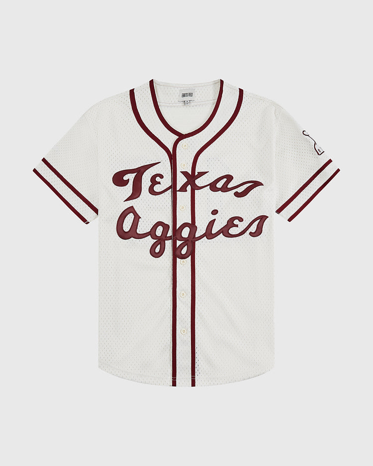 The Texas A&M University 1952 Mesh Baseball Jersey by Ebbets Field features a white mesh body, maroon trim and sleeve stripes, 