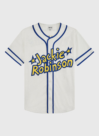 The Ebbets Field Jackie Robinson Comic Book Hero Mesh Baseball Jersey features bold Jackie Robinson lettering with star accents, white mesh fabric, and blue trim—honoring his legacy in breaking baseball’s color barrier.