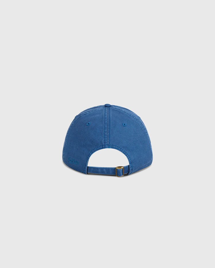 The Ebbets Field Coney Island Roller Skating Rink Washed Cotton Ballcap is shown from the back, highlighting its blue color, adjustable strap with a metal buckle, and a small opening—a nod to Brooklyn style.
