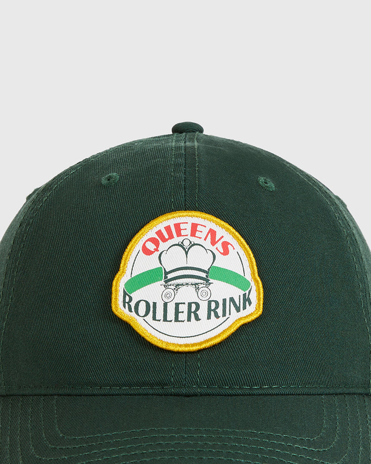 The Ebbets Field Queens Roller Rink Washed Cotton Ballcap is a green vintage hat featuring a patch with 