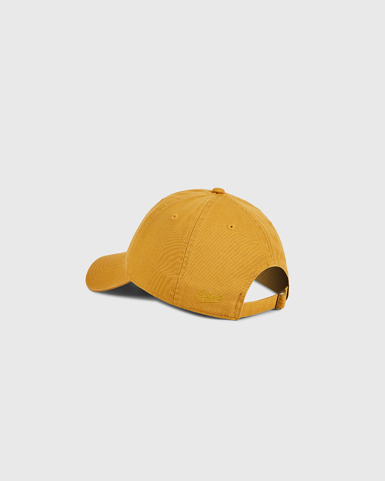 The Ebbets Field Hawaii Civic Auditorium Roller Rink Washed Cotton Ballcap in mustard yellow is shown from the back, featuring an adjustable strap and curved brim against a plain light gray background.