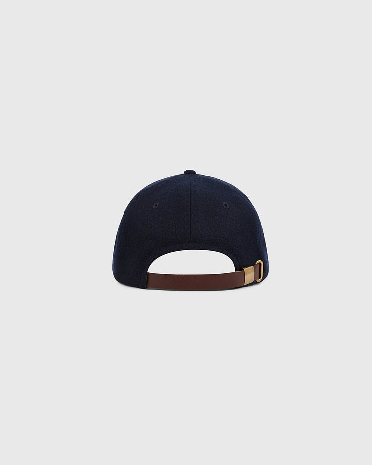 The Ebbets Field Los Angeles City Series Wool Ballcap is shown from the back, displaying a brown adjustable strap with a brass buckle against a plain light gray background.