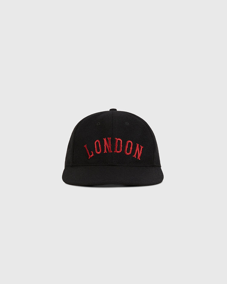 The Ebbets Field London City Series Wool Ballcap is a black baseball cap with 