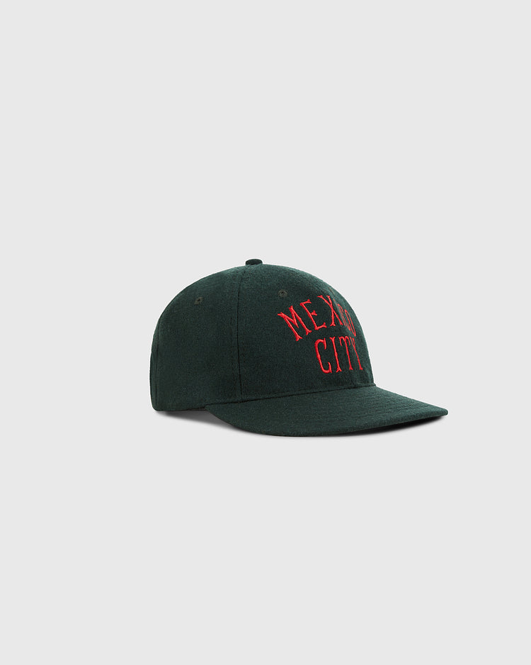 The Ebbets Field Mexico City City Series Wool Ballcap is a dark green hat with 