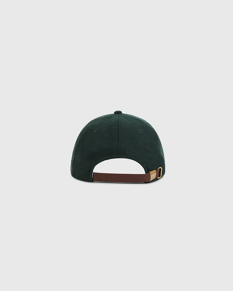 The Ebbets Field Mexico City City Series Wool Ballcap is shown from the back in dark green, highlighting its brown adjustable strap with a gold buckle, set against a plain light gray background.