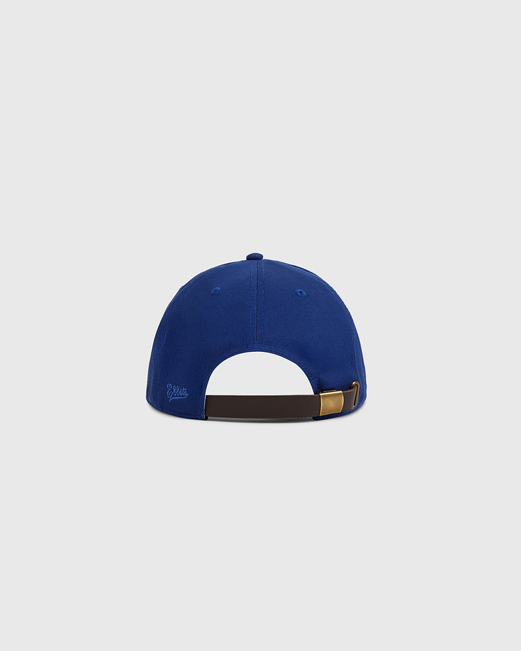 The Ebbets Field Santurce Cangrejeros Crab Cotton Twill Ballcap in blue features an adjustable brown strap with a brass buckle at the back, honoring Puerto Rican baseball and the Santurce Cangrejeros legacy.