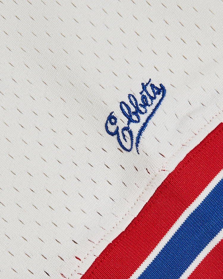 Close-up of the Puerto Rico 1972 National Team Mesh V-Neck Jersey by Ebbets Field, a white mesh baseball jersey with small perforations, 