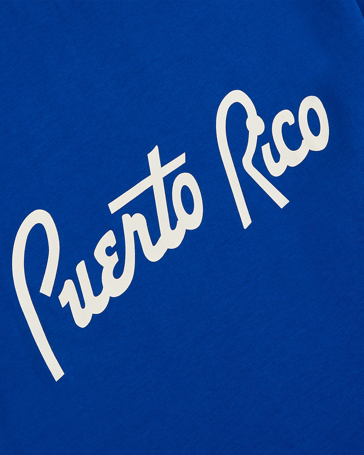 Celebrate Puerto Rican baseball history with the Ebbets Field Puerto Rico 1958 National Team Short Sleeve Tee, featuring white script text on blue—honoring the legendary Roberto Clemente and the iconic Caribbean Series.